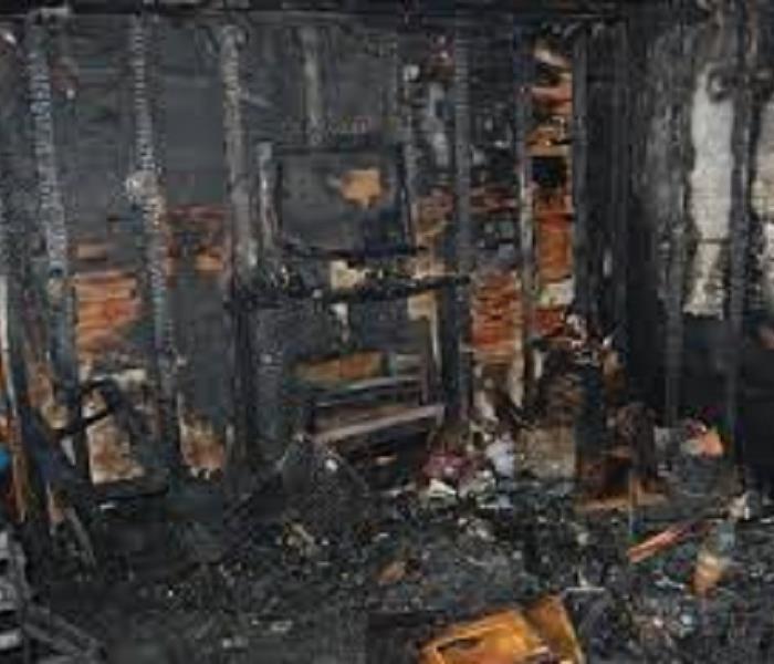 House wall severely burned by a fire