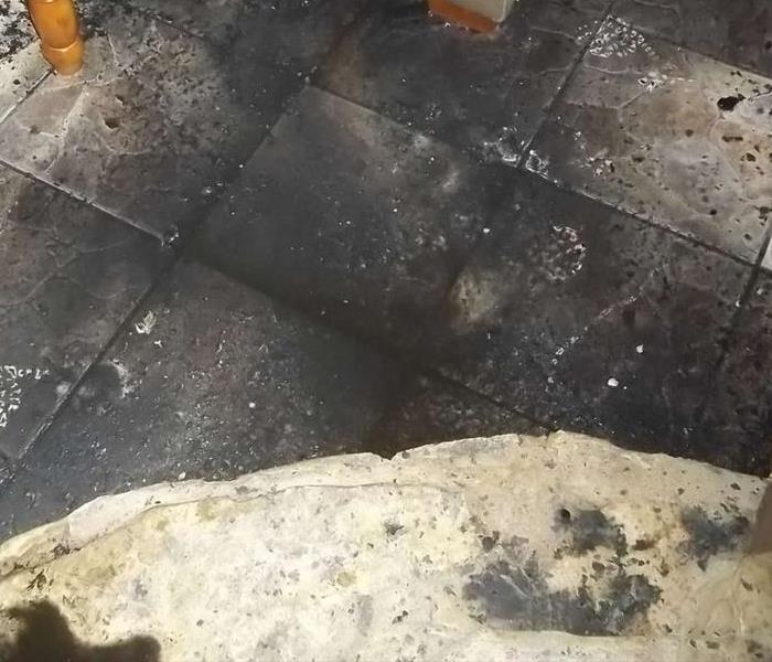 Fire charred tile flooring