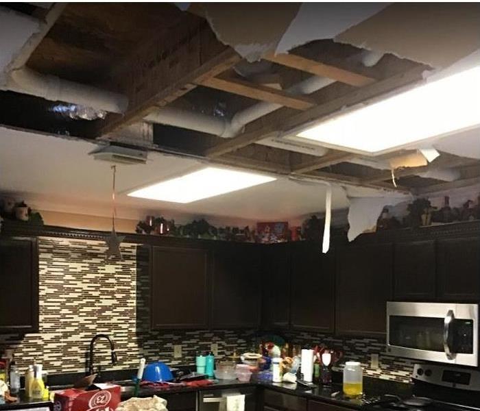 water damaged kitchen, ceiling tiles removed