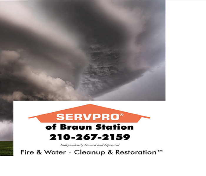 SERVPRO of Braun Station logo with phone number in front of dark stormy skies