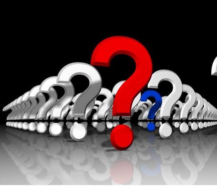 Several white question marks with a blue question mark in the middle and a red question mark in the front of them all
