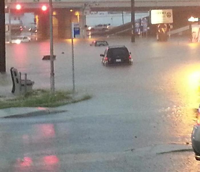 Vehicles crossing flooded roadways