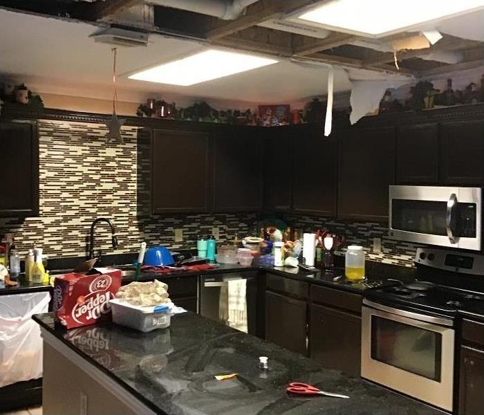 Water damaged kitchen; damaged ceiling removed