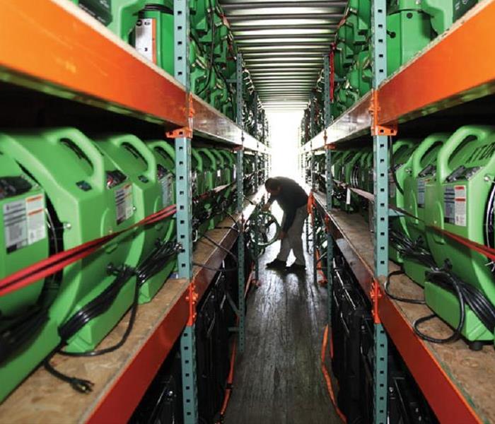 Racks of green air movers and equipment