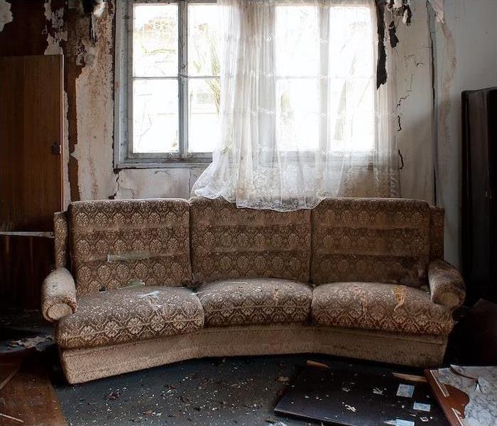 Fire damaged room and sofa