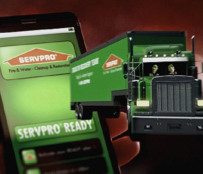 Green big rig truck and cellphone with Ready App on it