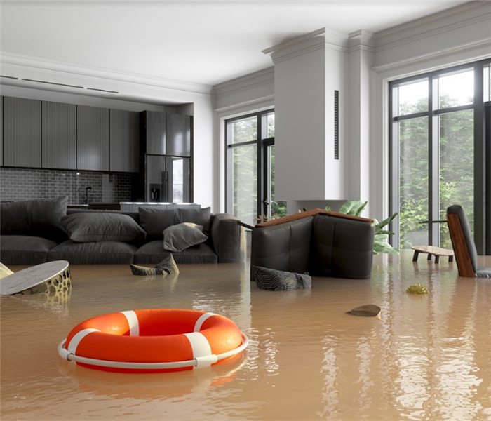 a flooded living room with furniture floating everywhere in floodwater