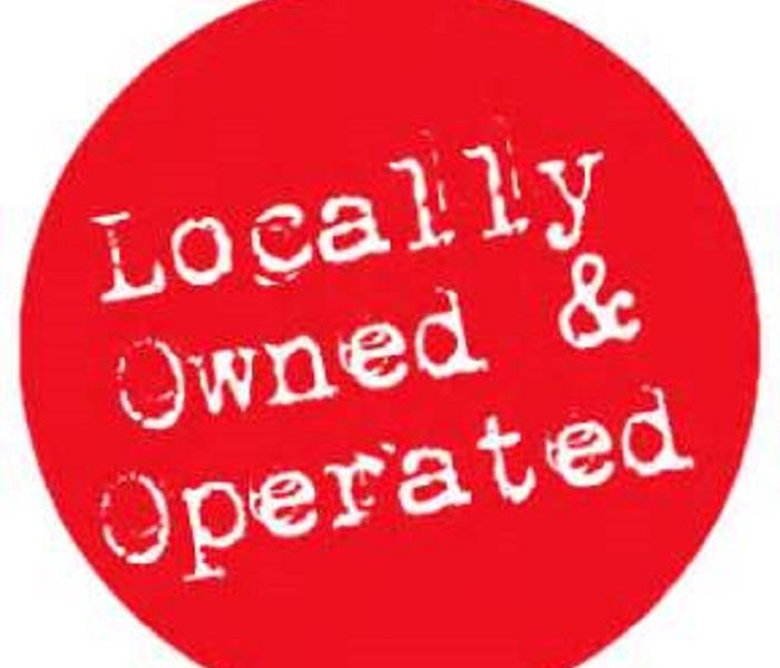 Red sticker that says locally owned & operated