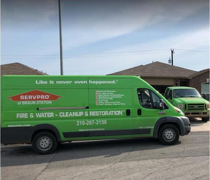 Picture of SERVPRO vehicles in front of a house