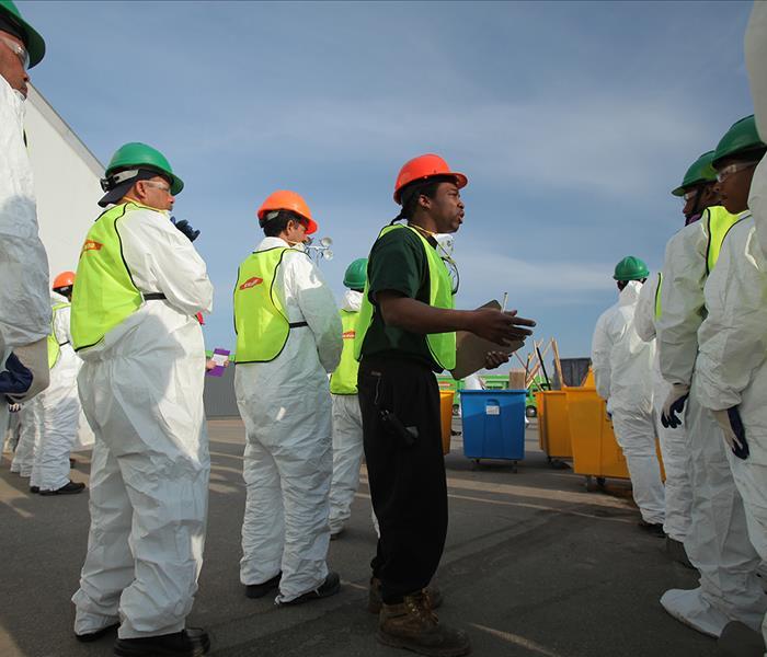 People in PPE suits and hard hats