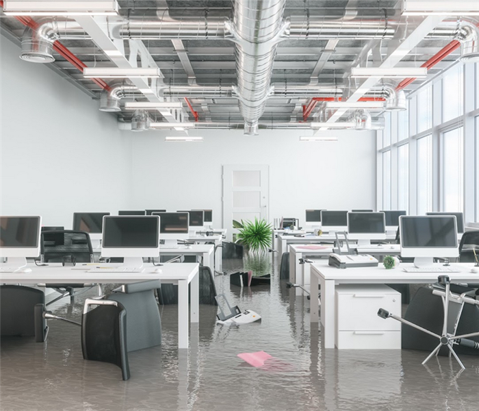 a flooded office with water covering the ground